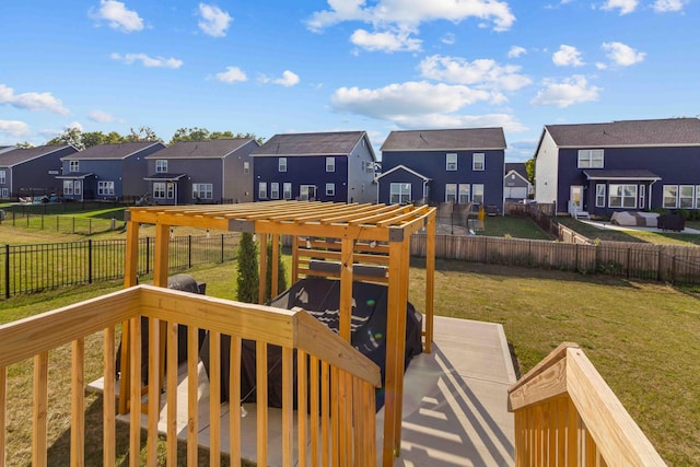 wooden terrace with a lawn