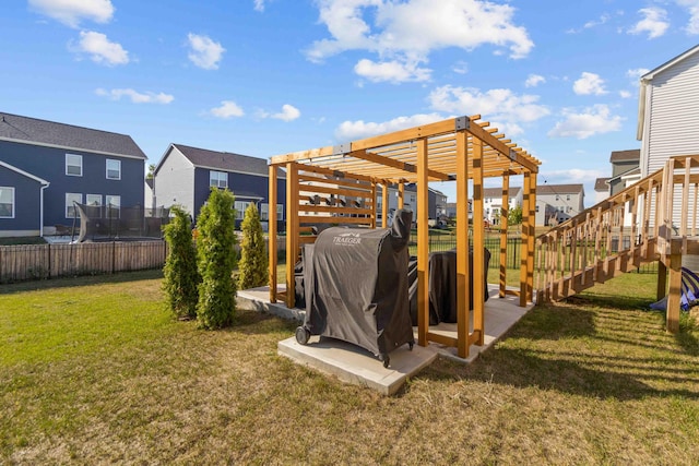 exterior space with a pergola and a trampoline