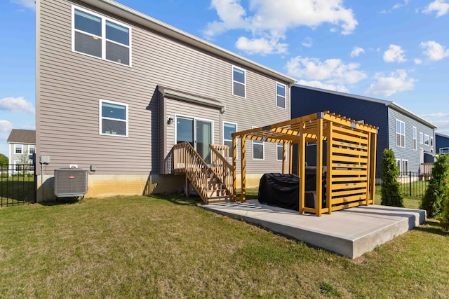 back of house with a pergola, a lawn, and cooling unit