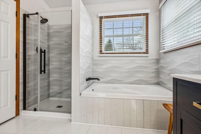 bathroom with tile patterned floors, vanity, and plus walk in shower