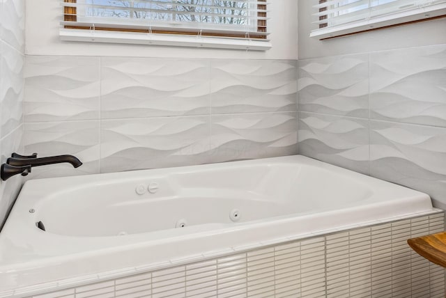 bathroom featuring a relaxing tiled tub