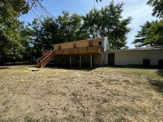 back of house featuring a wooden deck