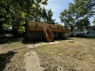 back of property featuring a deck