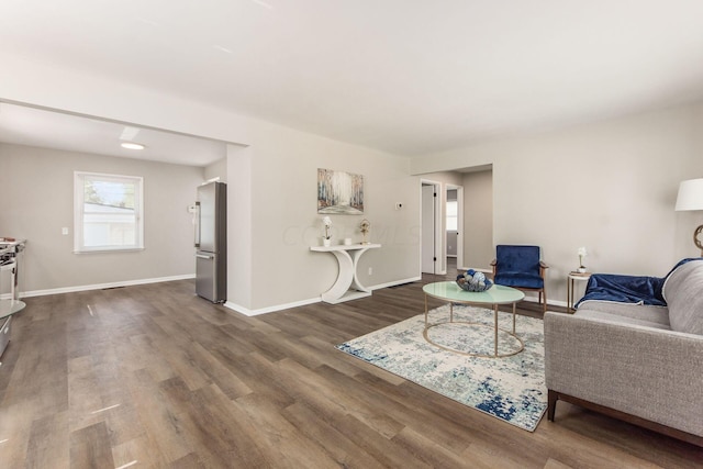 living room featuring dark wood-type flooring