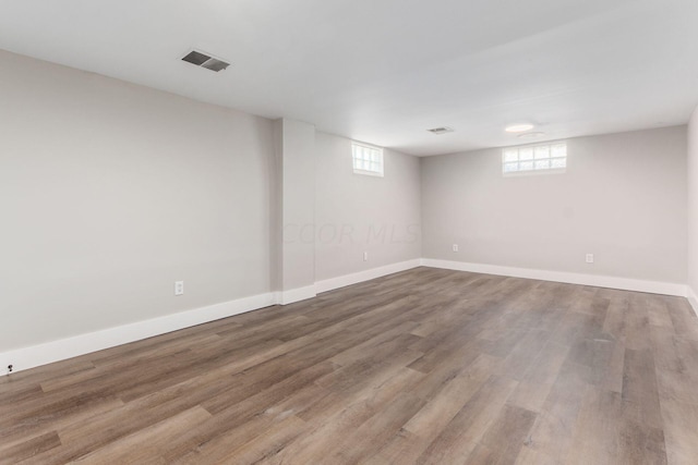 basement with hardwood / wood-style flooring and plenty of natural light