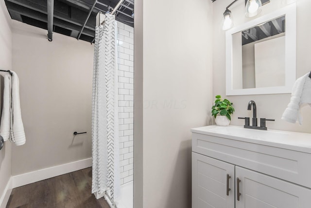 bathroom featuring a shower with curtain, vanity, and hardwood / wood-style flooring