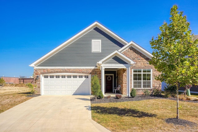 view of front of home with a garage and a front yard