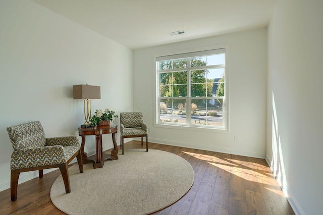 sitting room featuring hardwood / wood-style floors