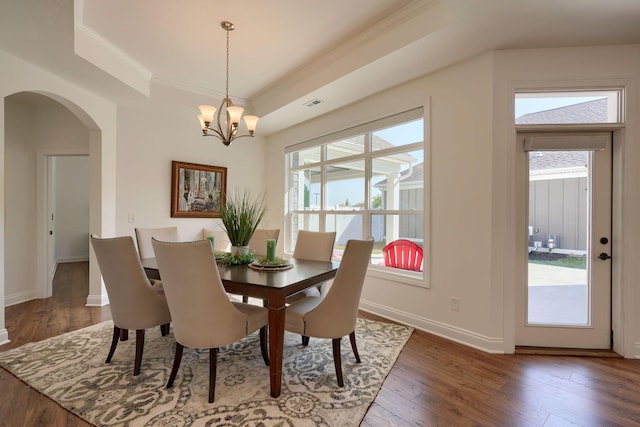 dining room with dark hardwood / wood-style flooring and plenty of natural light