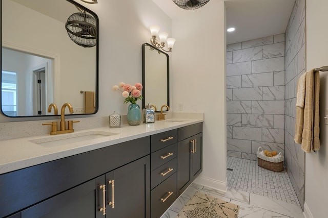 bathroom with vanity and a tile shower