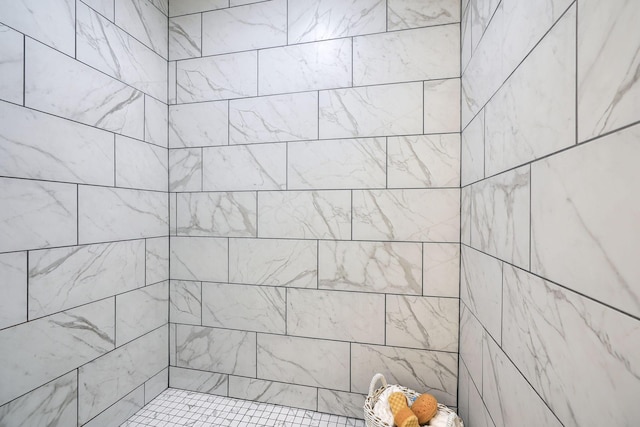 bathroom with a tile shower