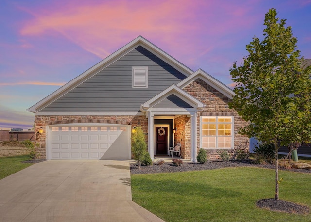 view of front of house featuring a yard and a garage