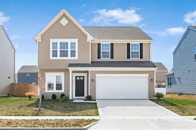 view of property with a front lawn and a garage