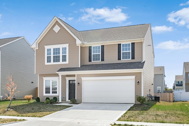 view of front of property with central AC, a front lawn, and a garage