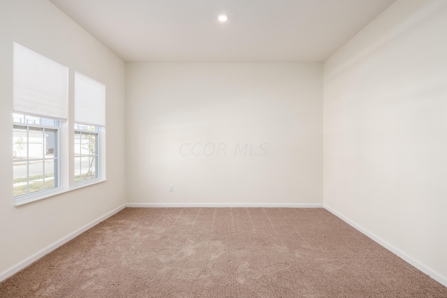 empty room with carpet flooring