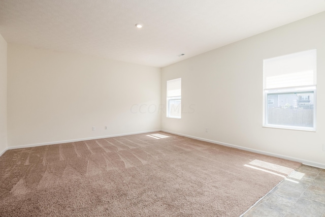 empty room featuring light carpet