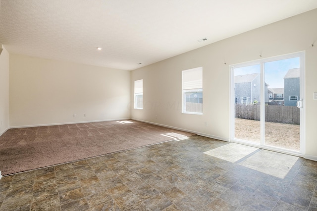 unfurnished room featuring carpet floors