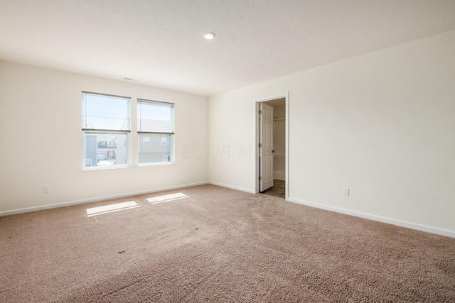 empty room featuring carpet floors