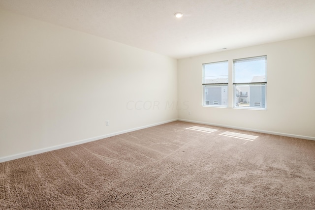 unfurnished room with carpet floors