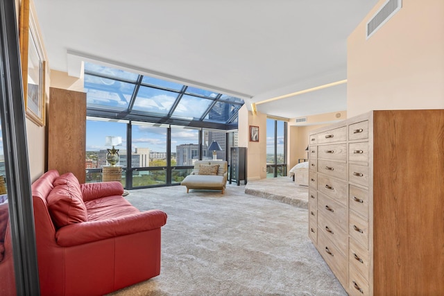 living room featuring light carpet and expansive windows