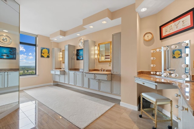 bathroom featuring tile patterned flooring and vanity