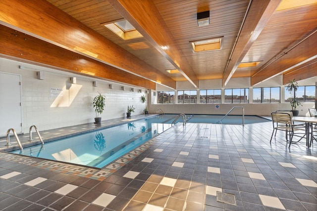 view of pool featuring a skylight