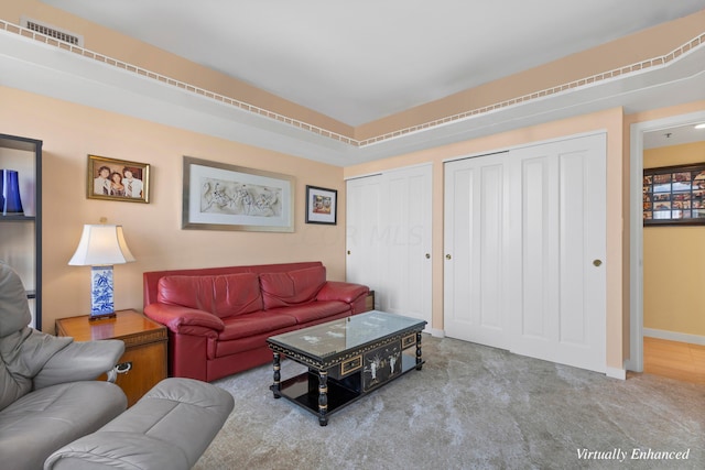 living room featuring light carpet