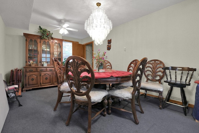 carpeted dining area with ceiling fan with notable chandelier and a textured ceiling