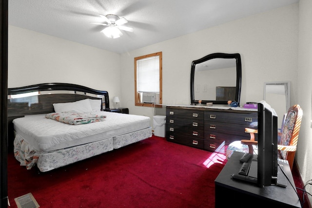 carpeted bedroom featuring ceiling fan, cooling unit, and a textured ceiling