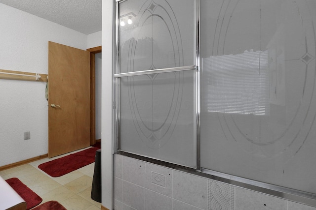 bathroom featuring a textured ceiling