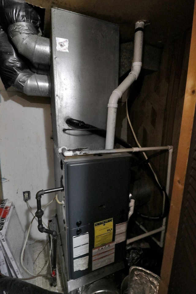 utility room with heating unit