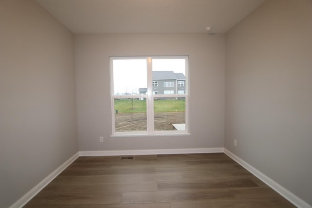 empty room featuring hardwood / wood-style floors