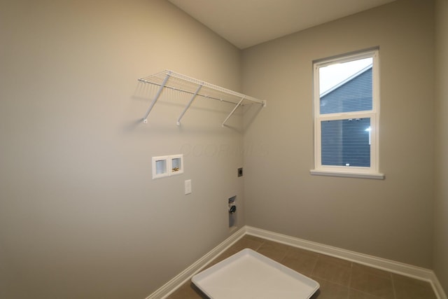 clothes washing area featuring electric dryer hookup, tile patterned flooring, and hookup for a washing machine