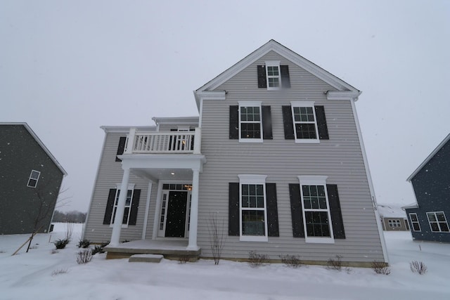 view of front of home with a balcony