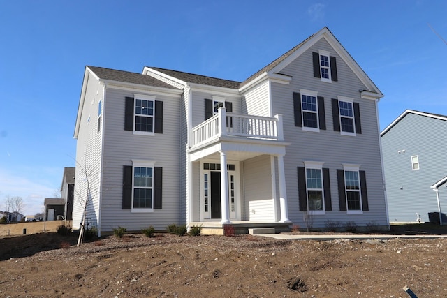 view of front of property featuring a balcony