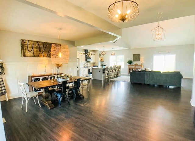 dining space featuring dark hardwood / wood-style flooring, vaulted ceiling, and a notable chandelier