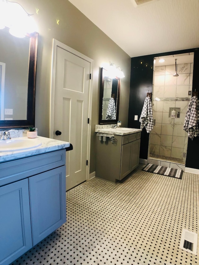 bathroom featuring vanity and a shower with door