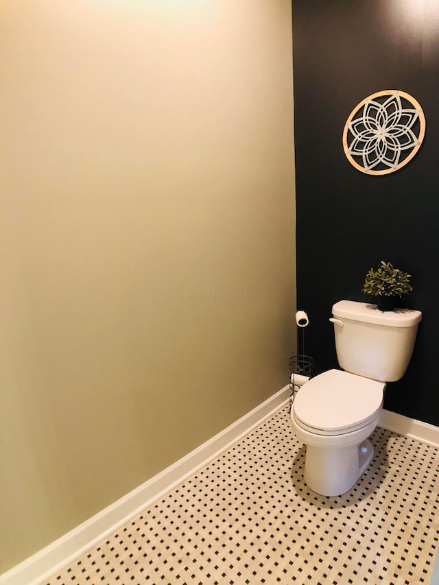 bathroom featuring tile patterned floors and toilet