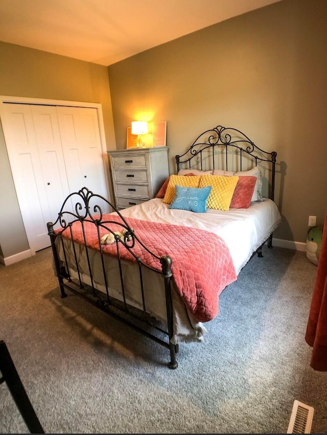 carpeted bedroom with a closet