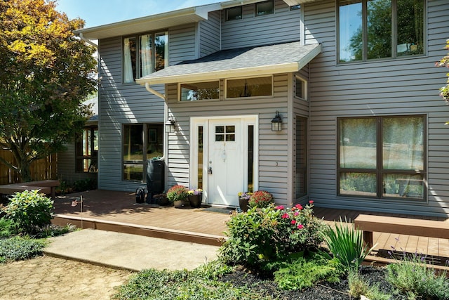 3630 Singing Wind Way, Urbana, OH 43078 - view of front facade with a wooden deck and roof with shingles
