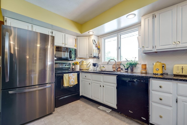 3630 Singing Wind Way, Urbana, OH 43078 - kitchen with black appliances, white cabinetry, tasteful backsplash, a textured ceiling, and recessed lighting