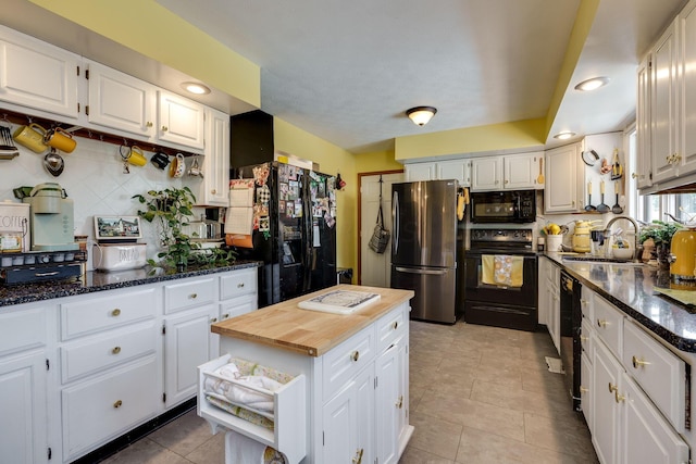 3630 Singing Wind Way, Urbana, OH 43078 - kitchen featuring black appliances, butcher block countertops, decorative backsplash, white cabinets, and light tile patterned floors