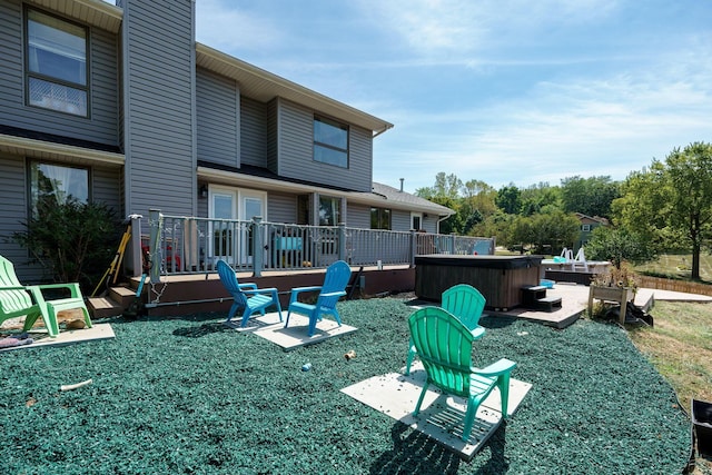 3630 Singing Wind Way, Urbana, OH 43078 - back of property featuring a hot tub, a wooden deck, and a patio area