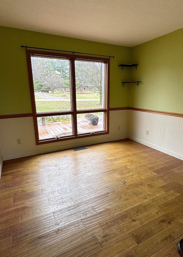 3630 Singing Wind Way, Urbana, OH 43078 - unfurnished room featuring hardwood / wood-style floors and healthy amount of natural light