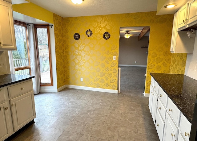 3630 Singing Wind Way, Urbana, OH 43078 - unfurnished dining area featuring wallpapered walls and a ceiling fan