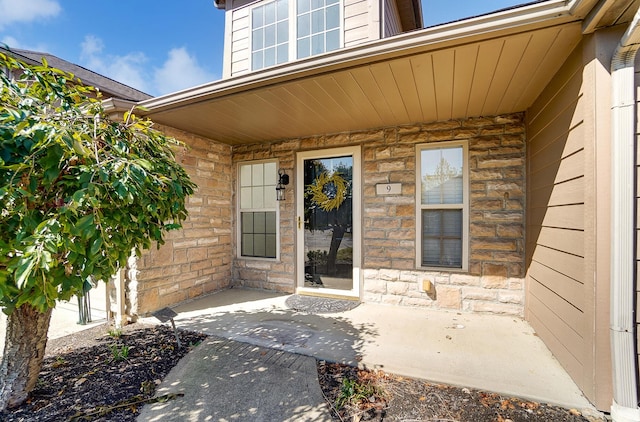 entrance to property with a patio