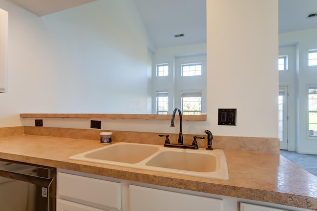 kitchen with black dishwasher and sink