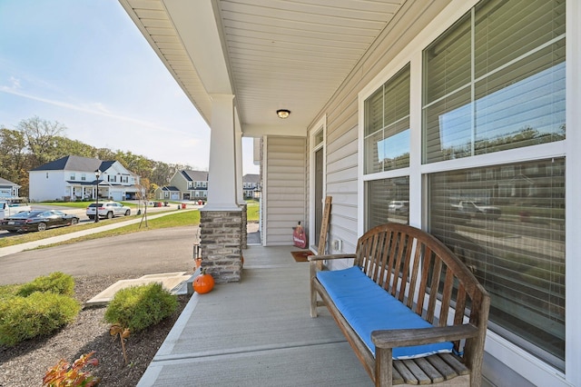 view of patio / terrace featuring a residential view and a porch