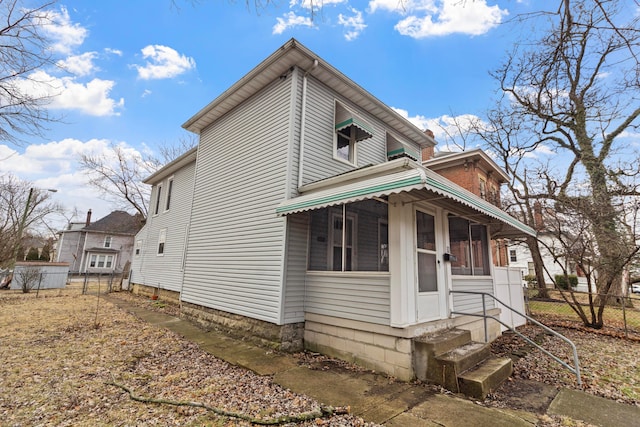 view of side of property featuring fence