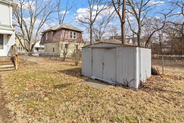 view of shed with a fenced backyard